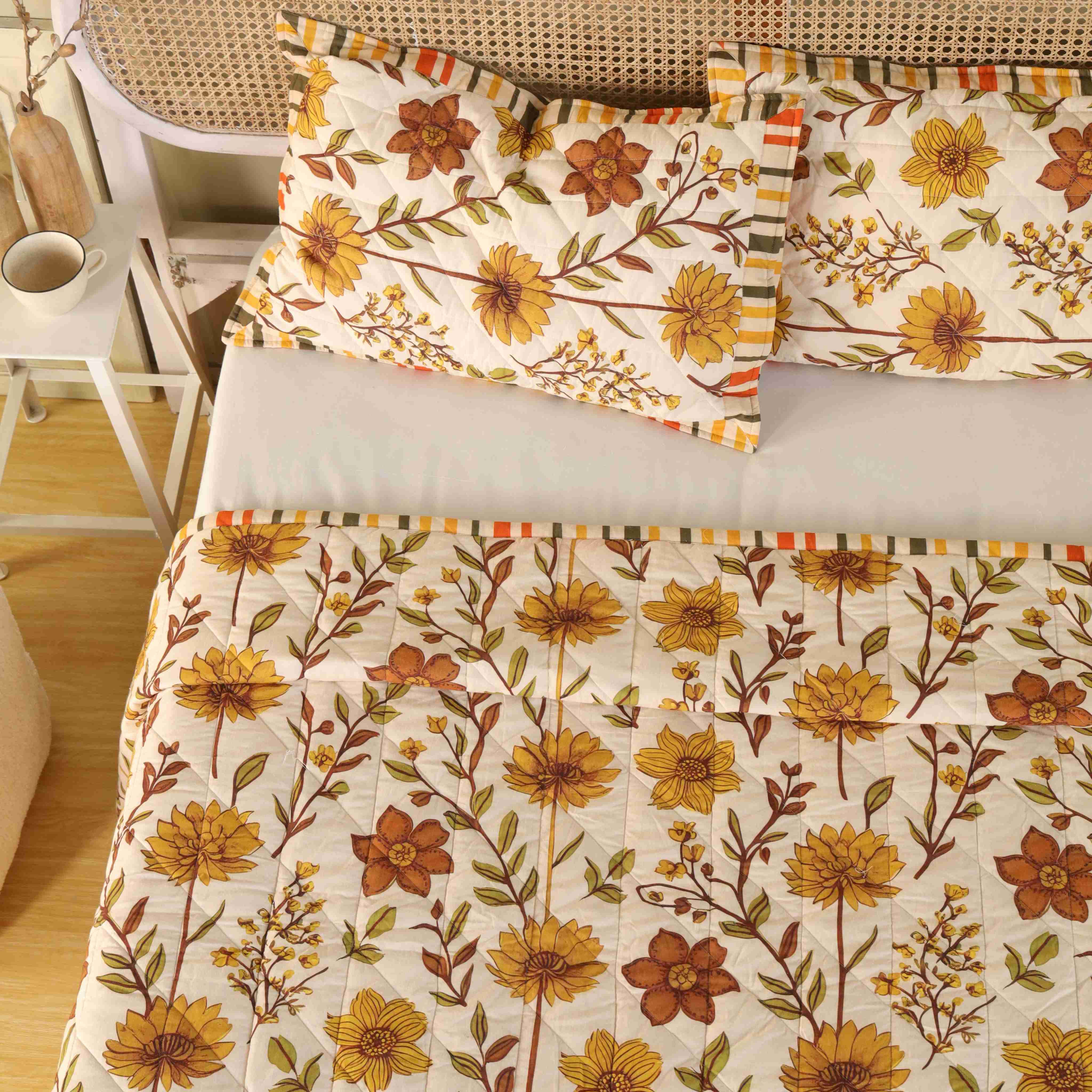 Neutral bedroom decor featuring a beige floral cotton quilt set.