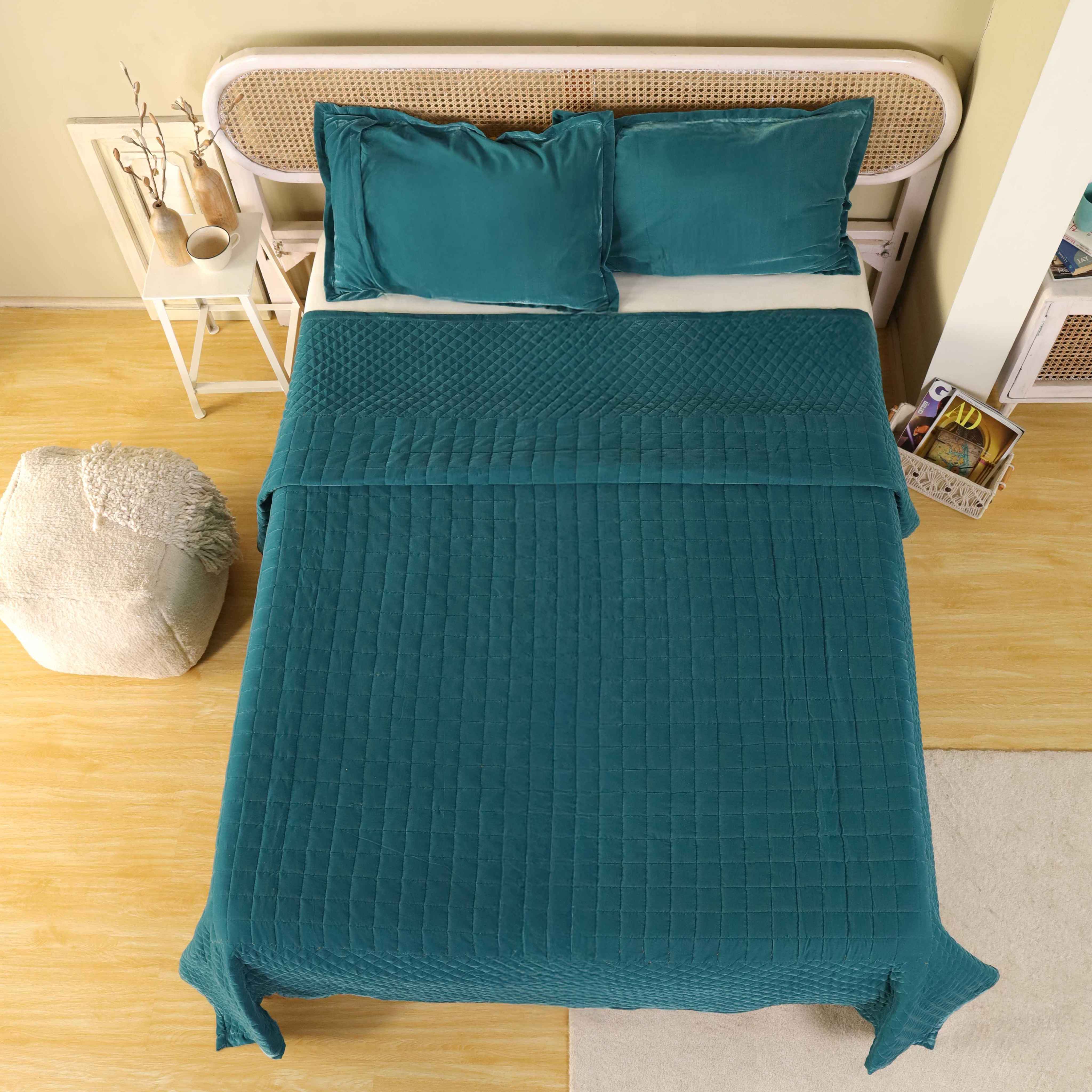 Premium teal blue velvet duvet cover with quilted diamond patterns on a modern bed.
