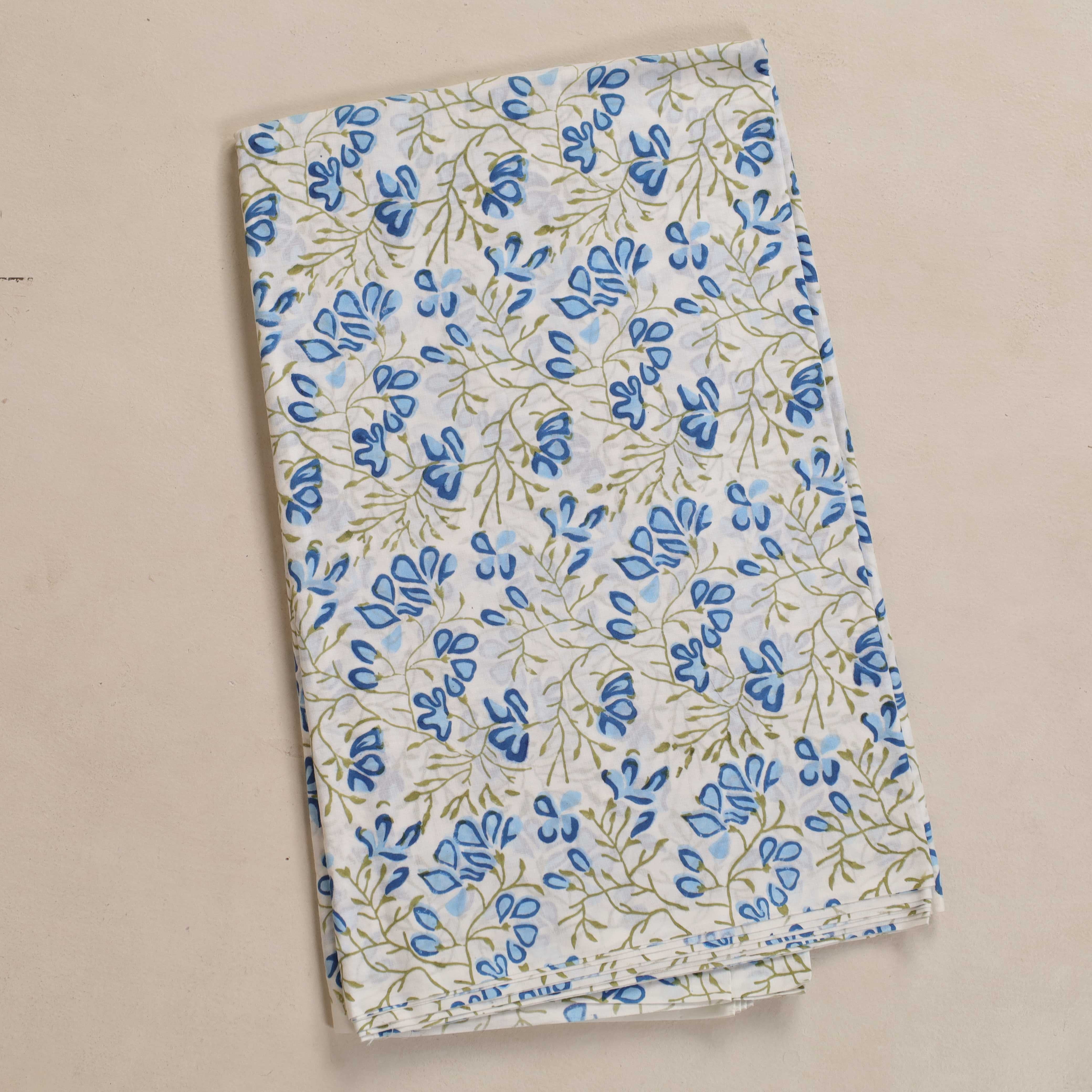 Floral-patterned fabric on a beige background
