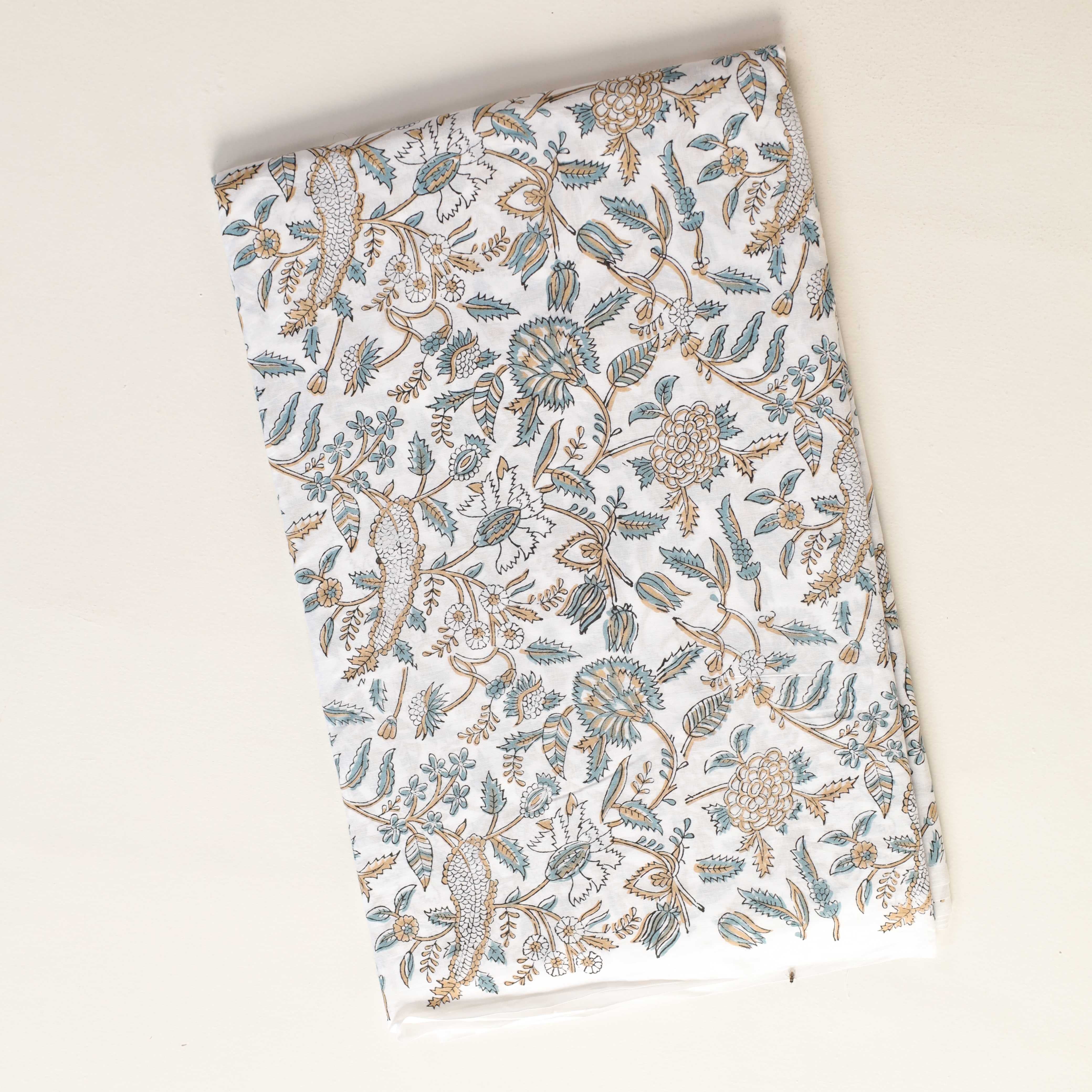 Floral patterned fabric on a beige background