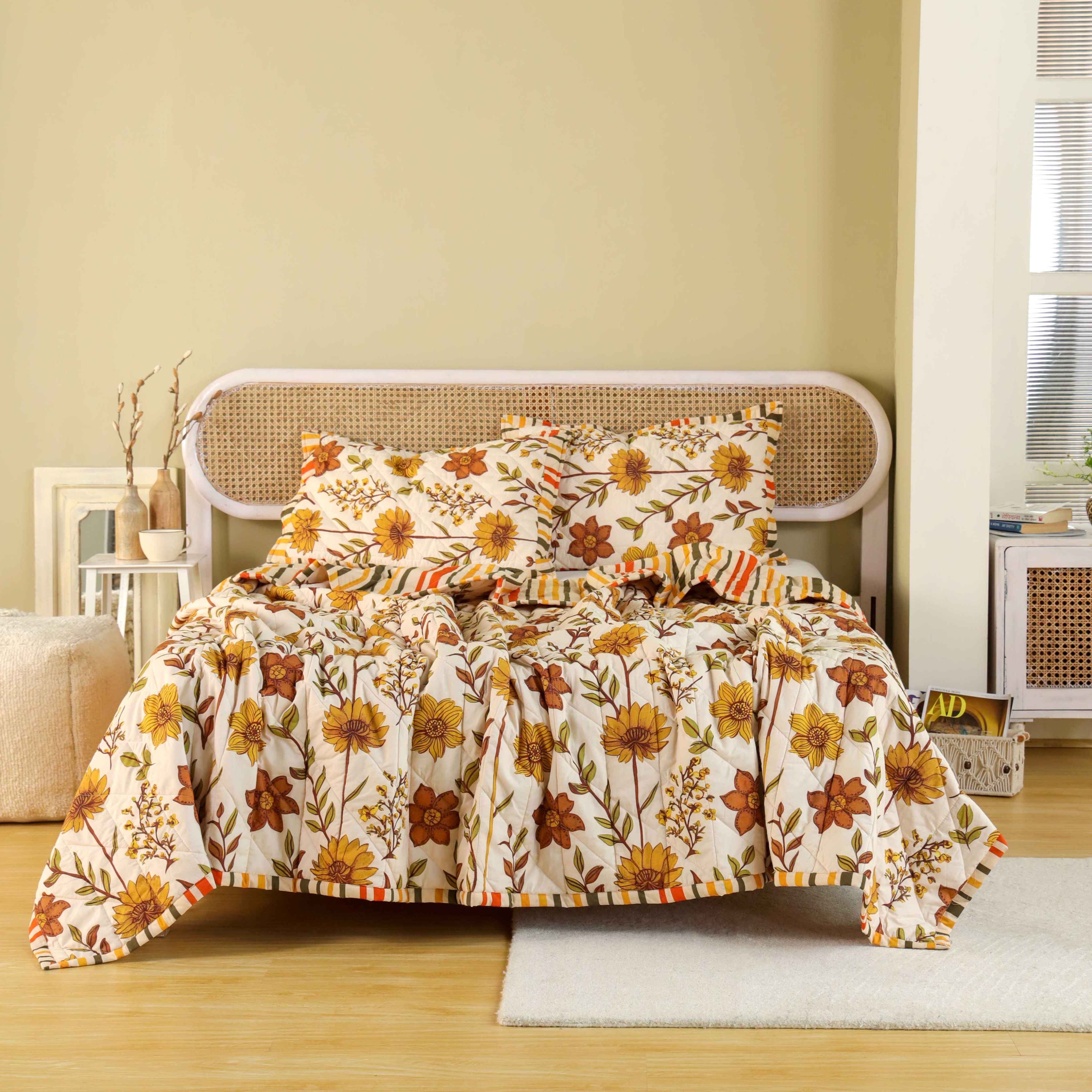 3-piece earthy beige cotton quilt set with olive floral print and striped border.