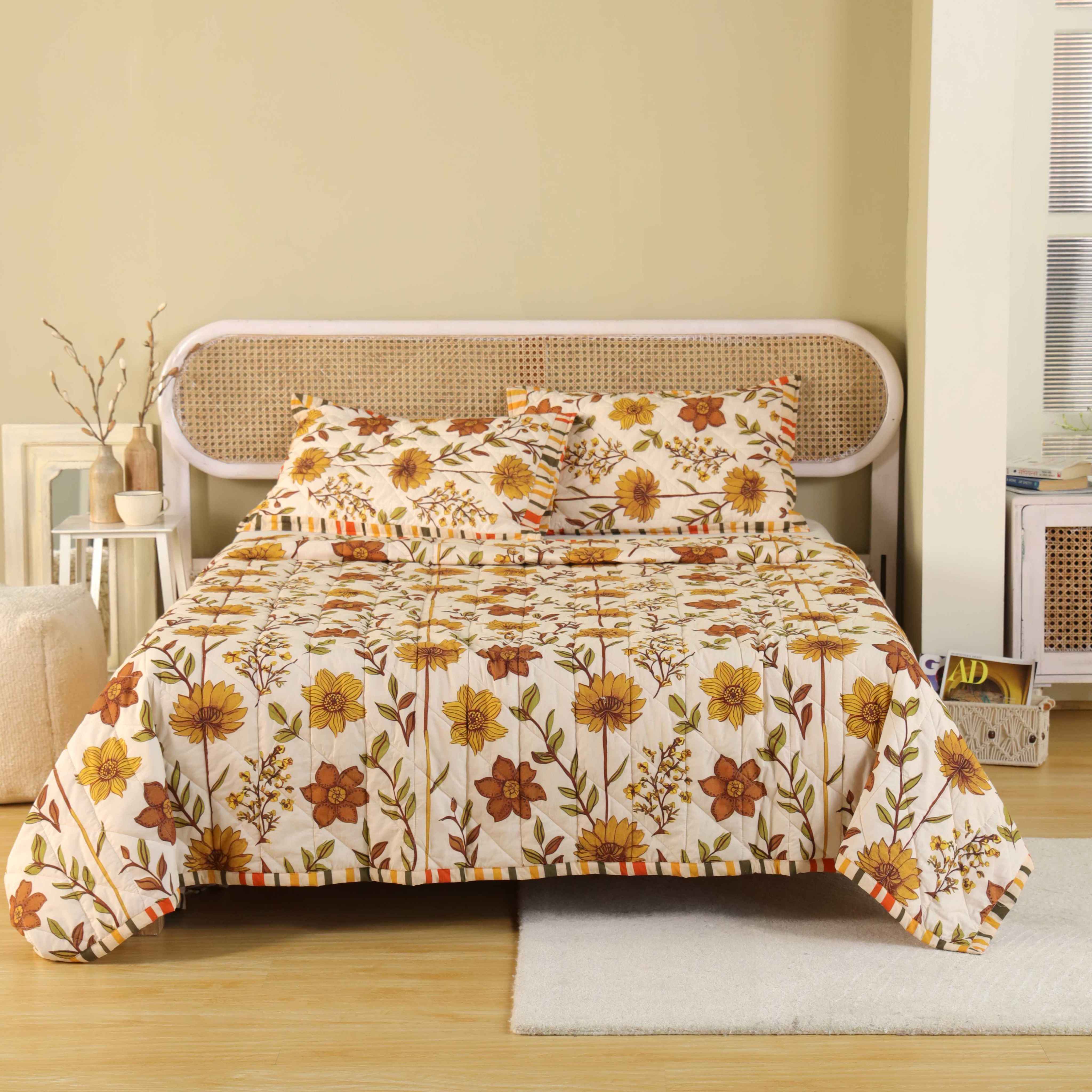 3-piece earthy beige cotton quilt set with olive floral print and striped border.