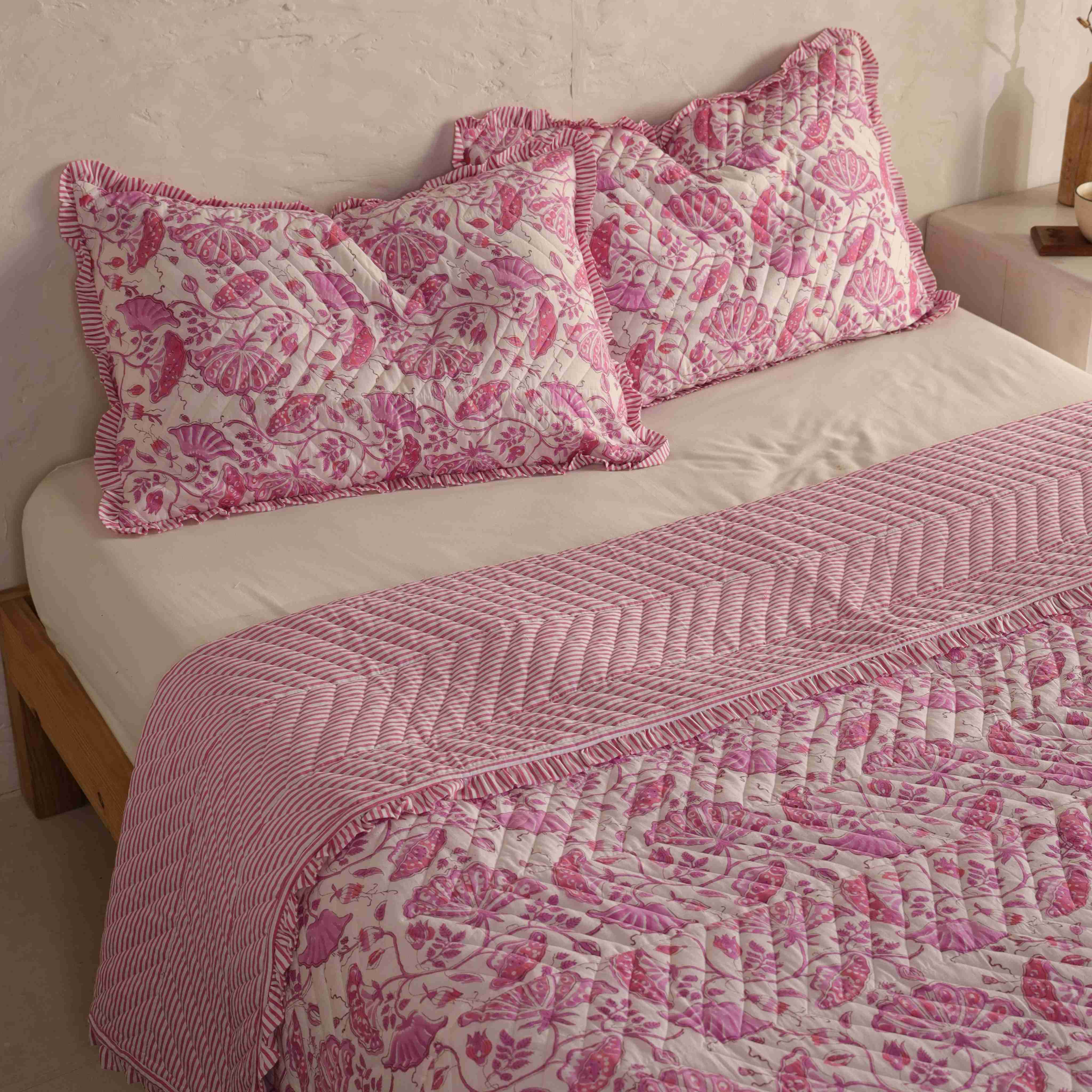 Close-up of the magenta floral pattern and soft pink velvet fabric.
